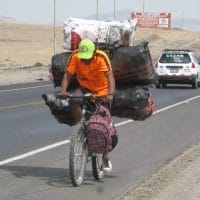 Peru Cyclist With Heavy Load