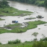 Trucks In River Colombia